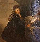 REMBRANDT Harmenszoon van Rijn A Scholar Seated at a Desk painting